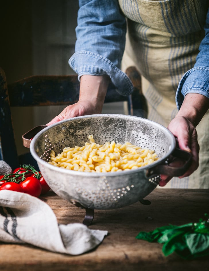 Draining pasta in a colander