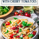 Side shot of a bowl of pasta with cherry tomatoes and a text title box at top