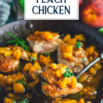 Close up side shot of a serving spoon with peach chicken in a cast iron skillet with text title overlay