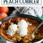 Side shot of two scoops of vanilla ice cream on an easy peach cobbler with text title box at top