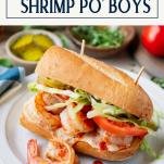 Shrimp po boy on a plate with text title box at top