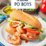 Shrimp po boy on a plate with text title overlay