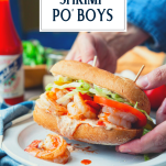 Hands holding shrimp po boy with text title overlay