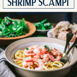 Side shot of a bowl of shrimp scampi pasta with text title box at top