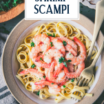 Close overhead shot of a bowl of shrimp scampi pasta with text title overlay
