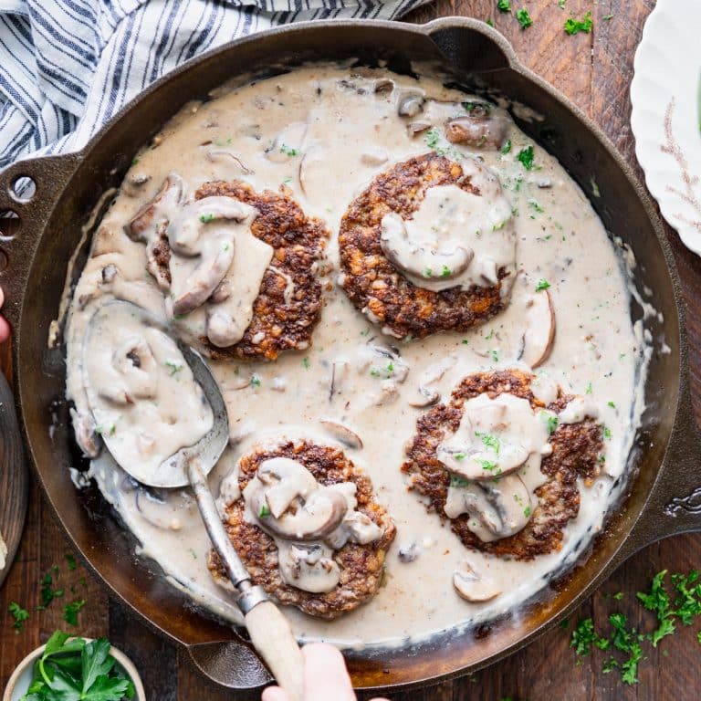 Overhead shot of a skillet of hamburger steak.