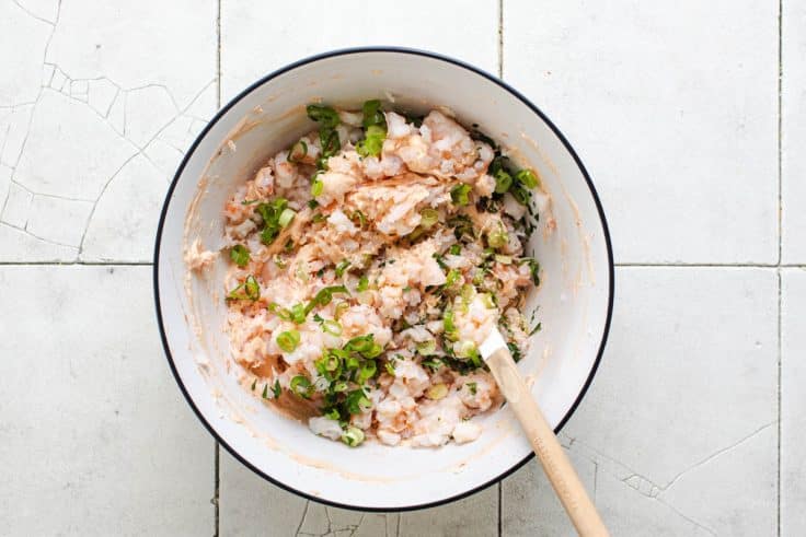 Process shot showing how to make shrimp dip.