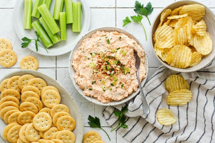 Horizontal overhead image of shrimp dip on a table.