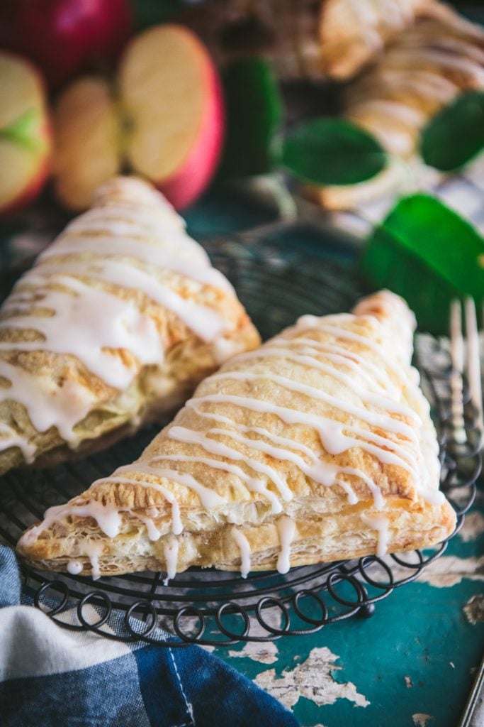 Close up side shot of an apple turnover on a cooling rack