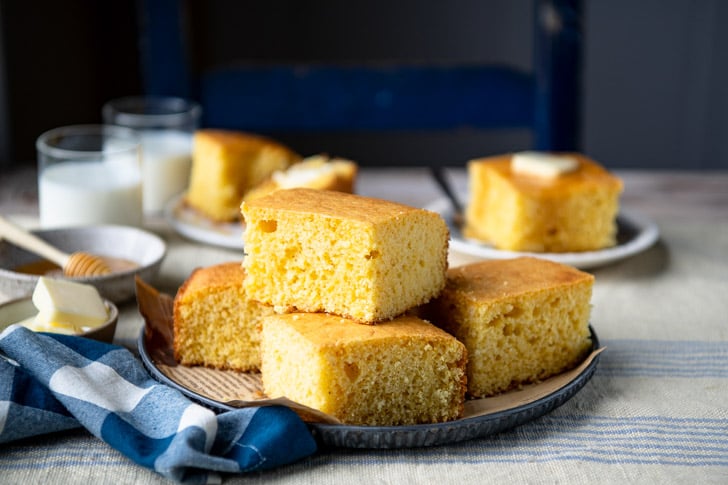 Horizontal side shot of a plate of cornbread with cake mix