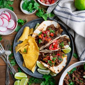 Overhead shot of a square featured image of a plate of beef barbacoa