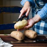 Peeling russet potatoes
