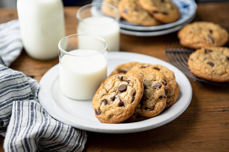 Horizontal shot of homemade chocolate chip cookies on a wooden table