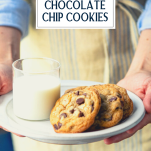 Hands holding a plate of easy chocolate chip cookies with text title overlay