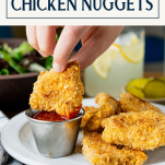Dipping homemade chicken nuggets with text title box at top