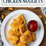Overhead shot of a plate of baked chicken nuggets with text title box at top