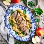 Square overhead featured image of baked pork tenderloin with apples