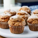 Square side shot of easy pumpkin muffins on a white tray