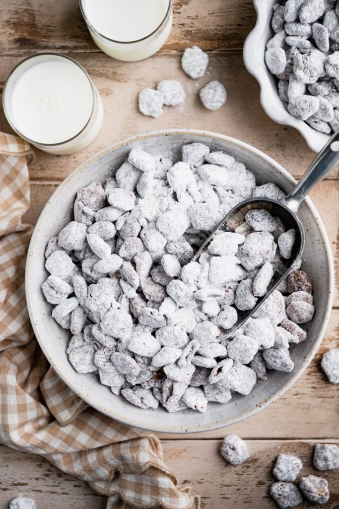 Overhead shot of a scoop inside a bowl of puppy chow