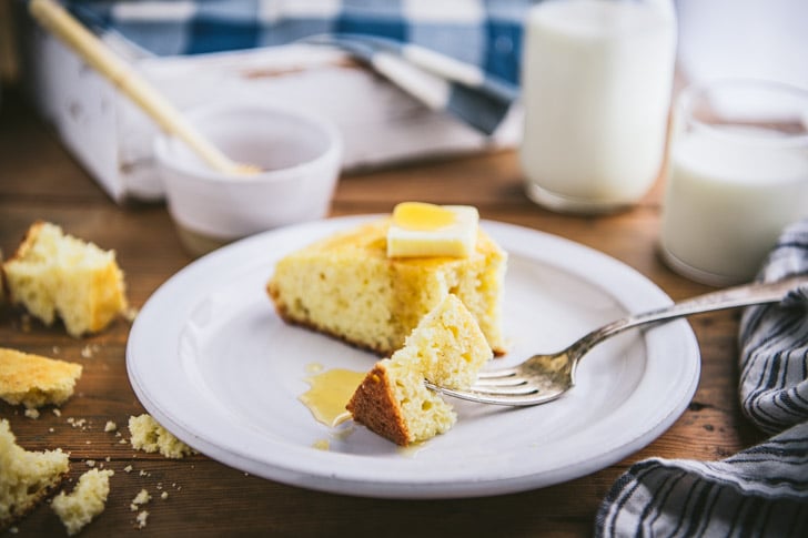 Horizontal side shot of a bite of southern cornbread on a fork