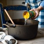 Adding canned corn to a pot