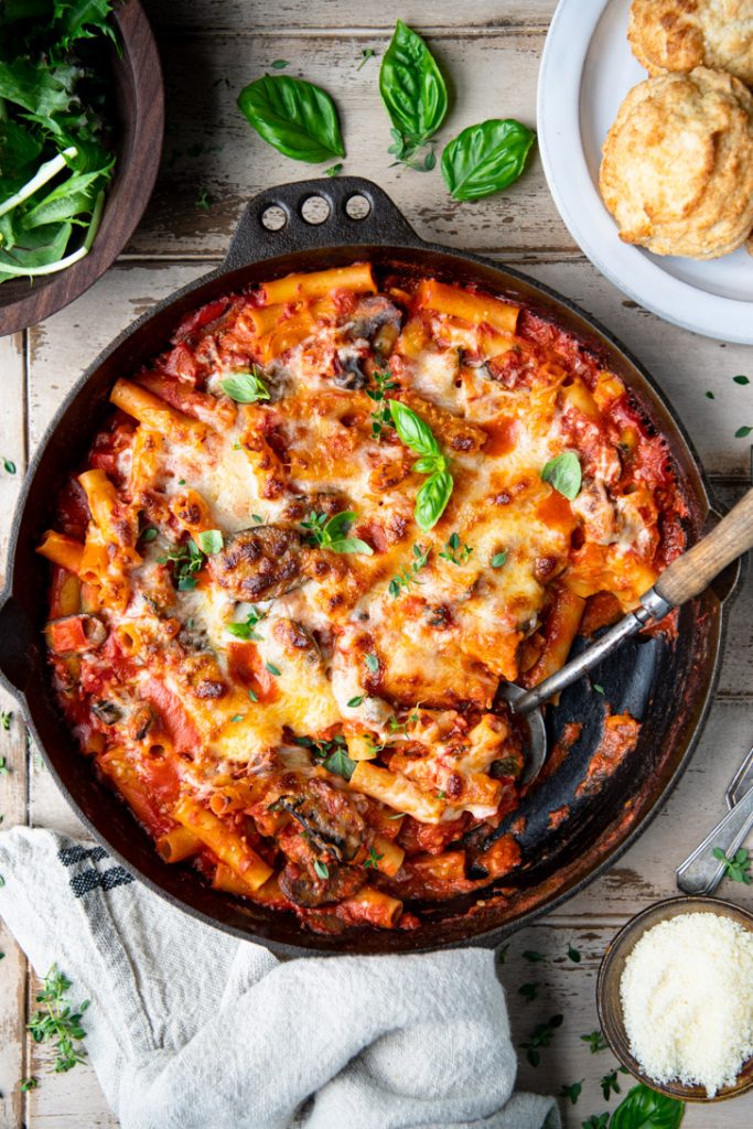 Overhead shot of vegetable baked ziti in a cast iron skillet