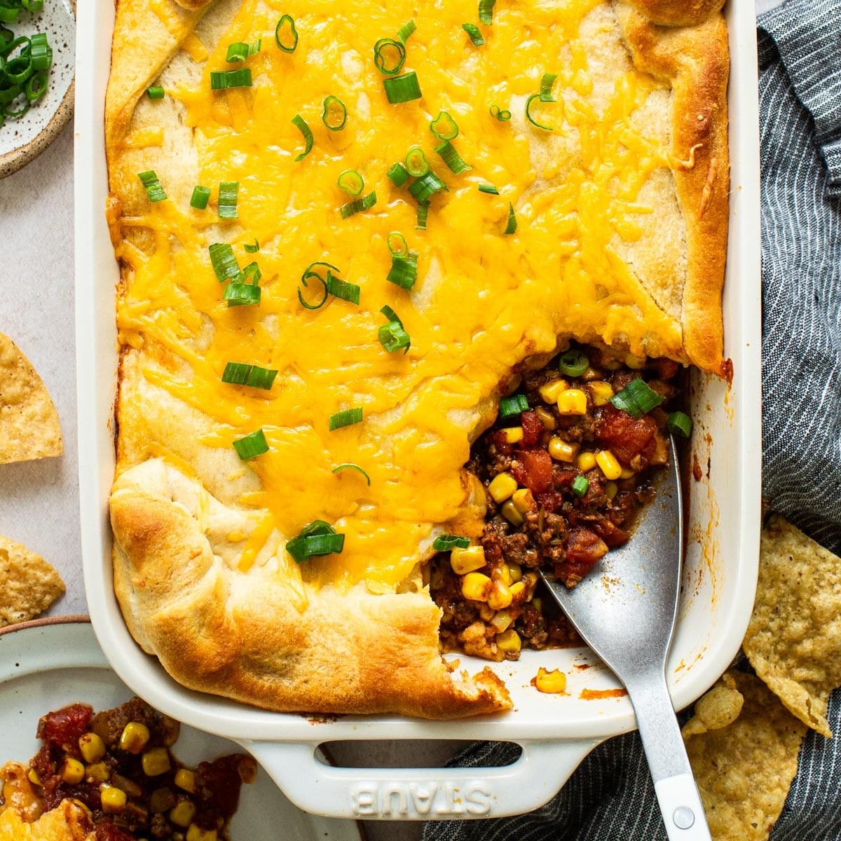 Square overhead shot of a pan of crescent roll taco bake.