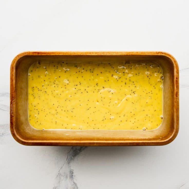 Lemon loaf batter in a baking dish.