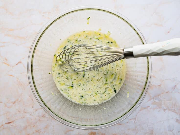 Whisking wet ingredients.