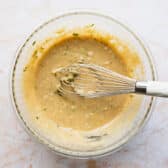 Zucchini bread batter in a glass bowl.
