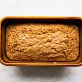 Baked zucchini bread still in the loaf pan.