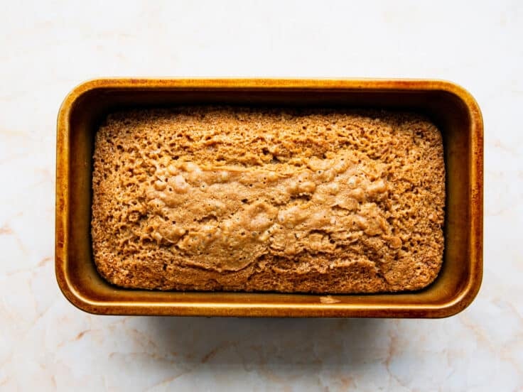 Baked zucchini bread still in the loaf pan.