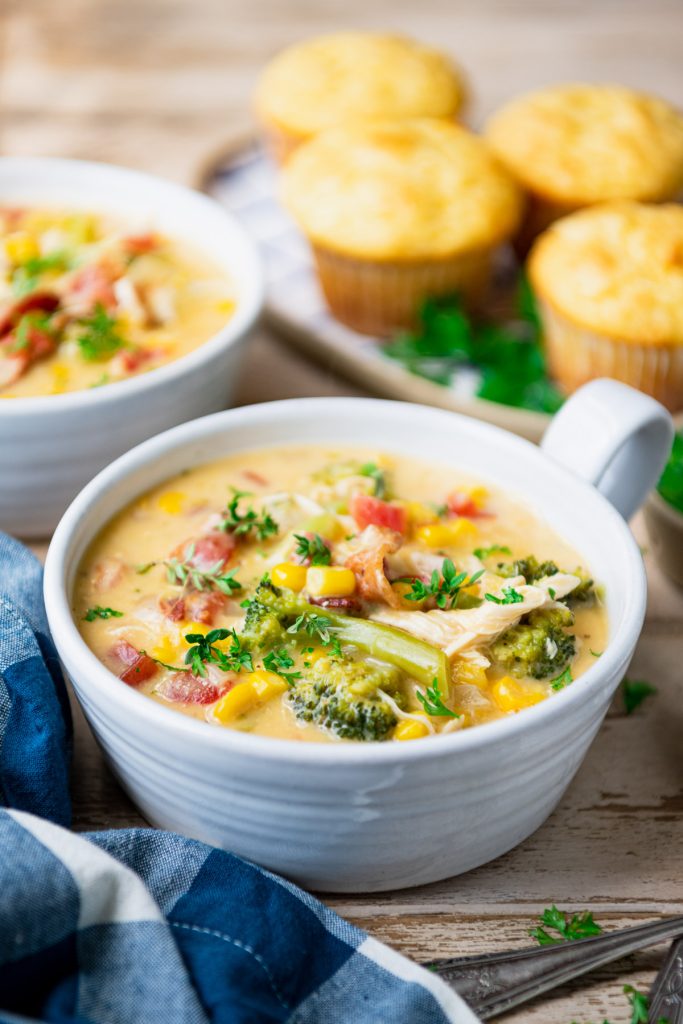 Front shot of chicken corn chowder in a white bowl on a table