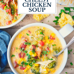 Overhead shot of a bowl of cheesy crock pot chicken soup with text title overlay
