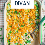 Overhead shot of a pan of chicken divan with text title overlay