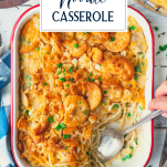 Spoon serving chicken and noodle casserole with text title overlay