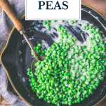 Skillet of creamed peas with text title overlay