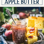 Side shot of crockpot apple butter in a jar with text title box at top