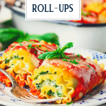 Two lasagna roll ups on a plate with text title overlay