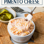 Platter of pimento cheese on a plate with crackers and text title box at top