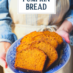 Hands holding a platter of pumpkin bread with text title overlay