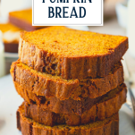 Stack of pumpkin bread slices with text title overlay