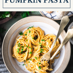 Bowl of creamy pumpkin pasta with text title box at top
