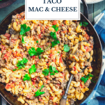 Skillet of taco mac and cheese with text title overlay