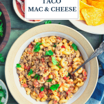 Bowl of taco mac and cheese with text title overlay