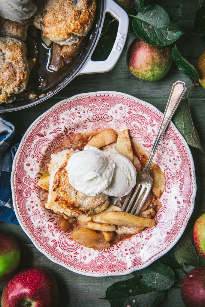 Overhead shot of a plate of apple cobbler with ice cream
