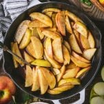 Square overhead shot of a skillet of baked apple slices
