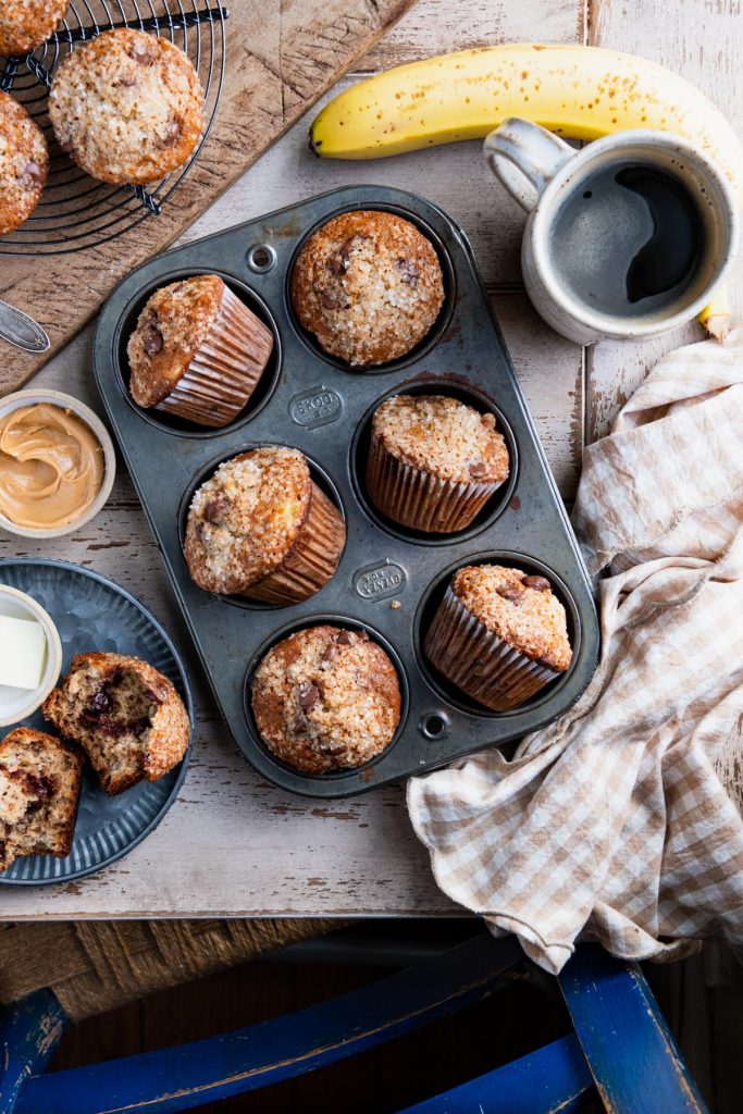 Breakfast table with banana chocolate chip muffins and coffee