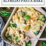 Overhead image of a pan of broccoli and cheese Alfredo pasta bake with text title box at top