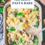 Pan of broccoli cheese alfredo pasta bake with text title overlay